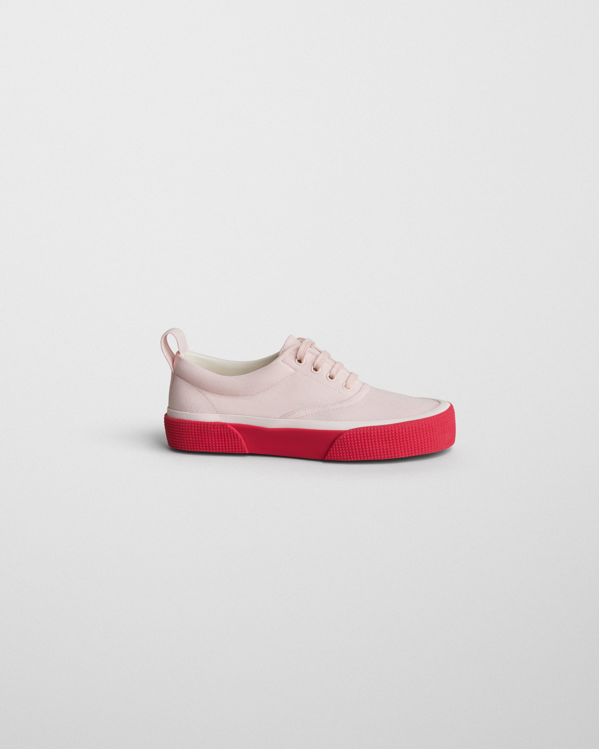 Side view of PLIMSOLE in soft pink canvas