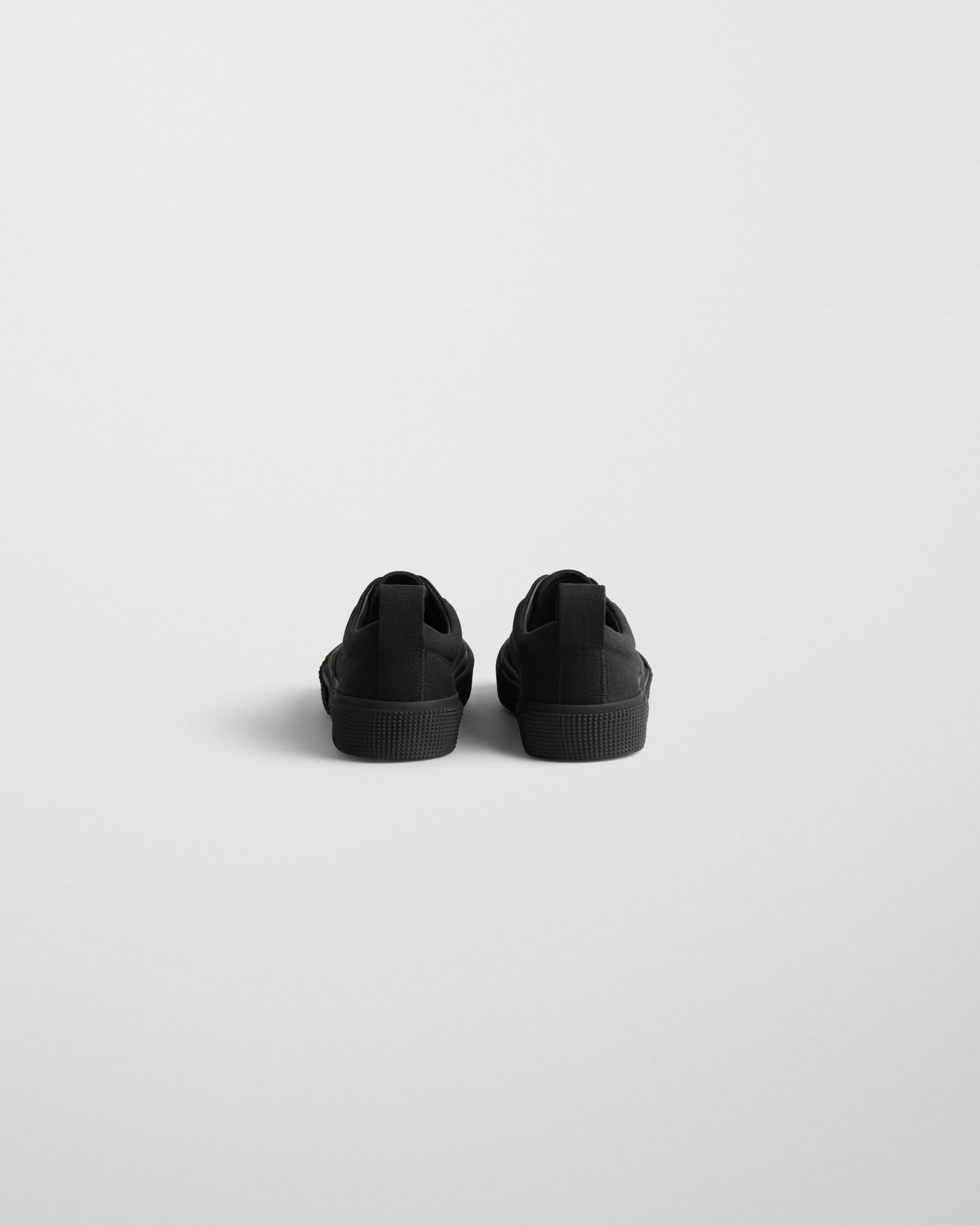 Back view of PLIMSOLE in black canvas