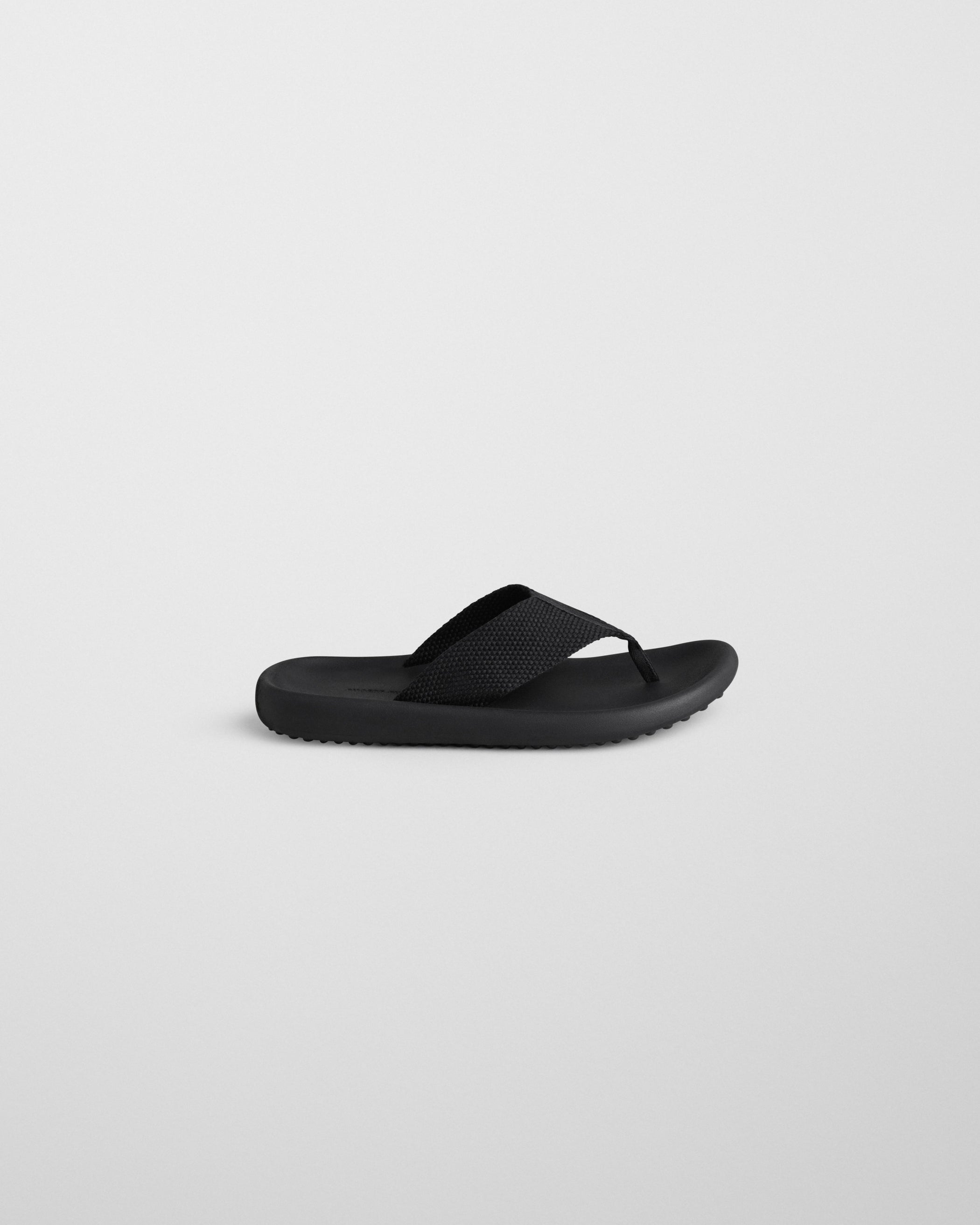 Side view of FLIP FLOP in black Eva