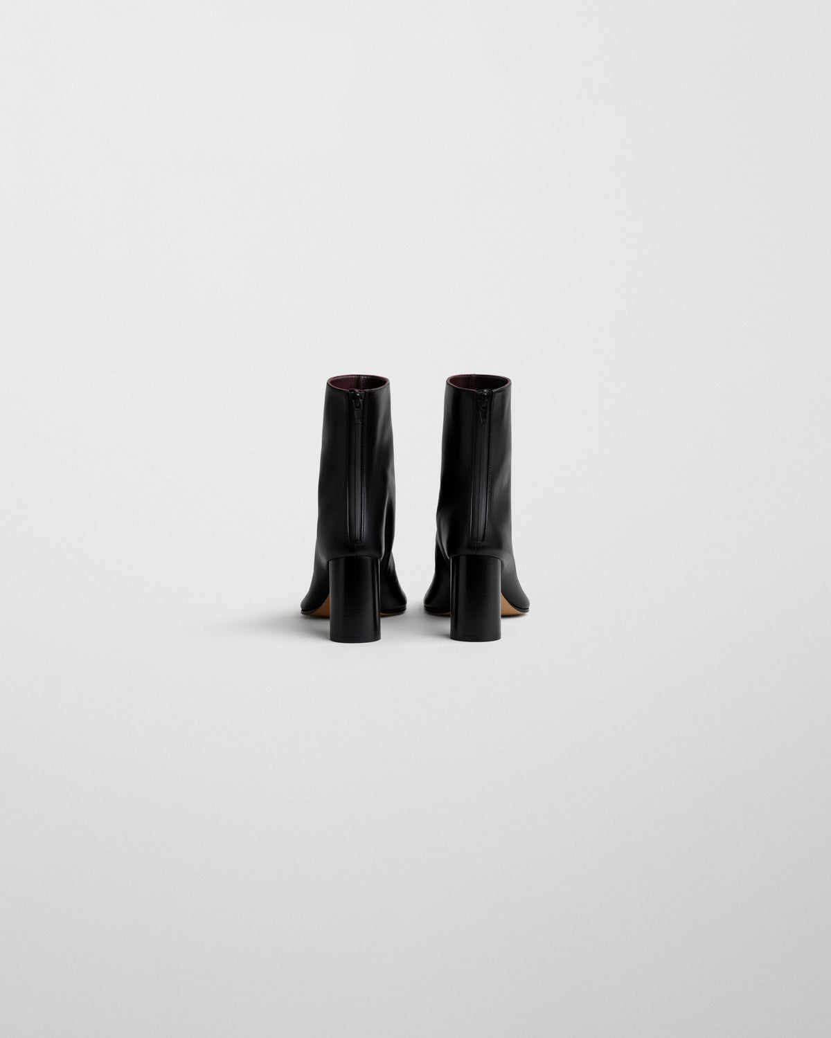 Back view of TUG ANKLE BOOT in black leather