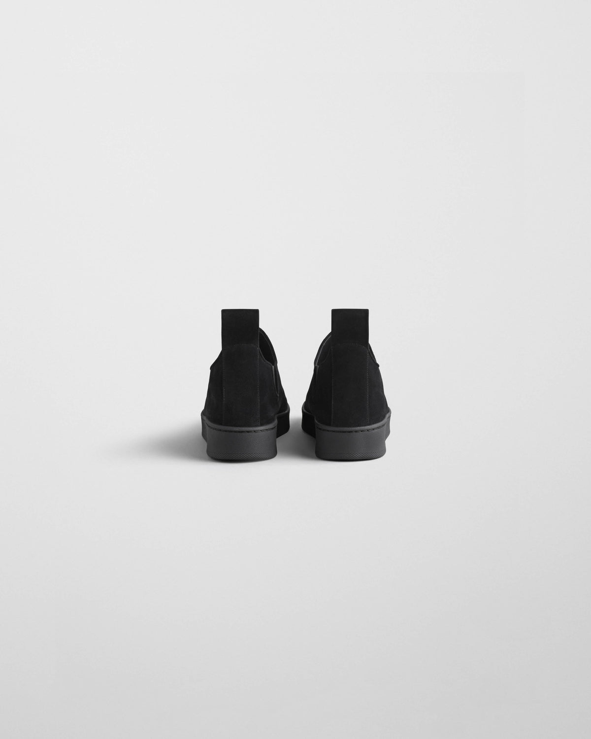 Back view of SLIP SNEAKER in black suede
