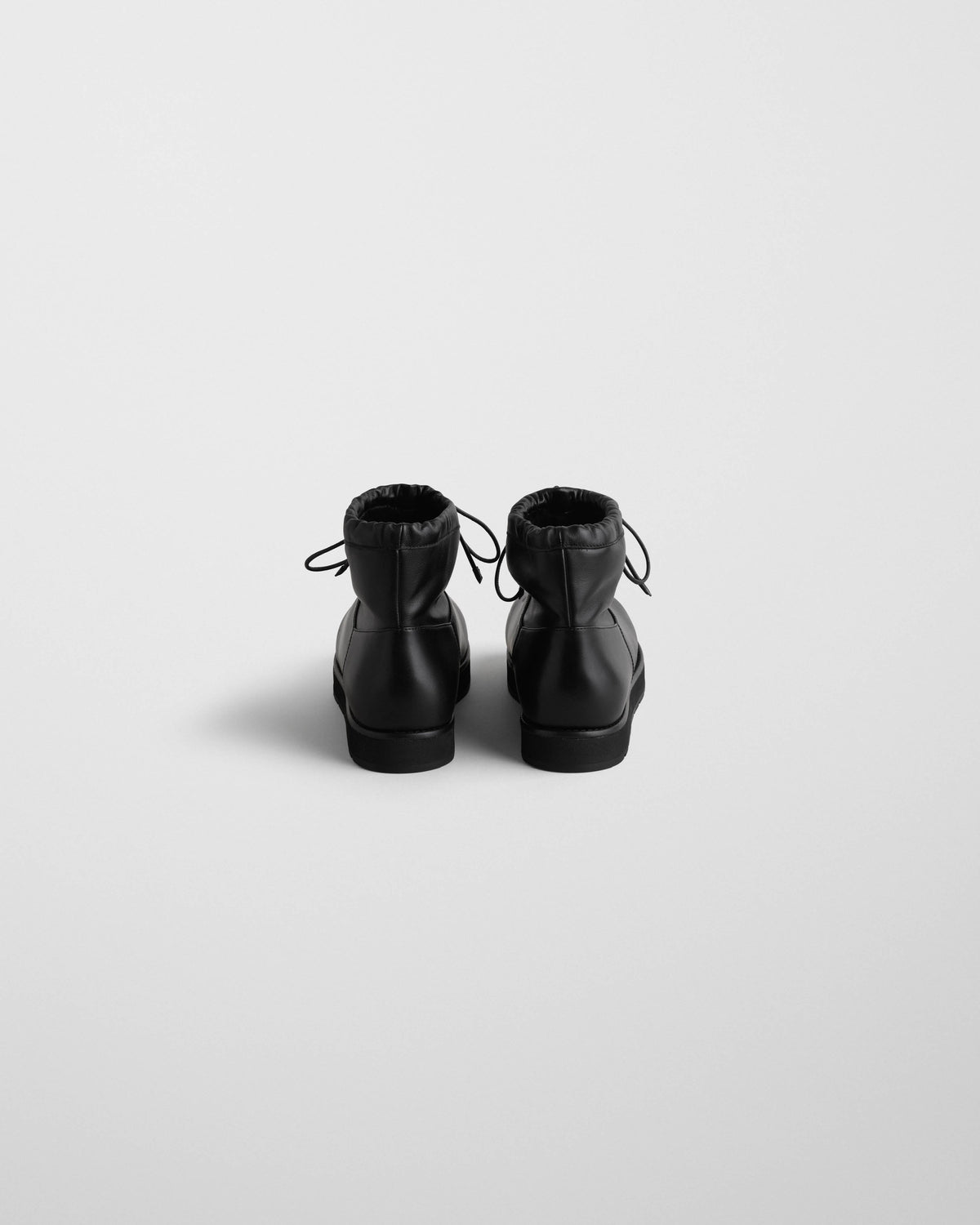 Back view of SHEARLING BOOTIE in black leather
