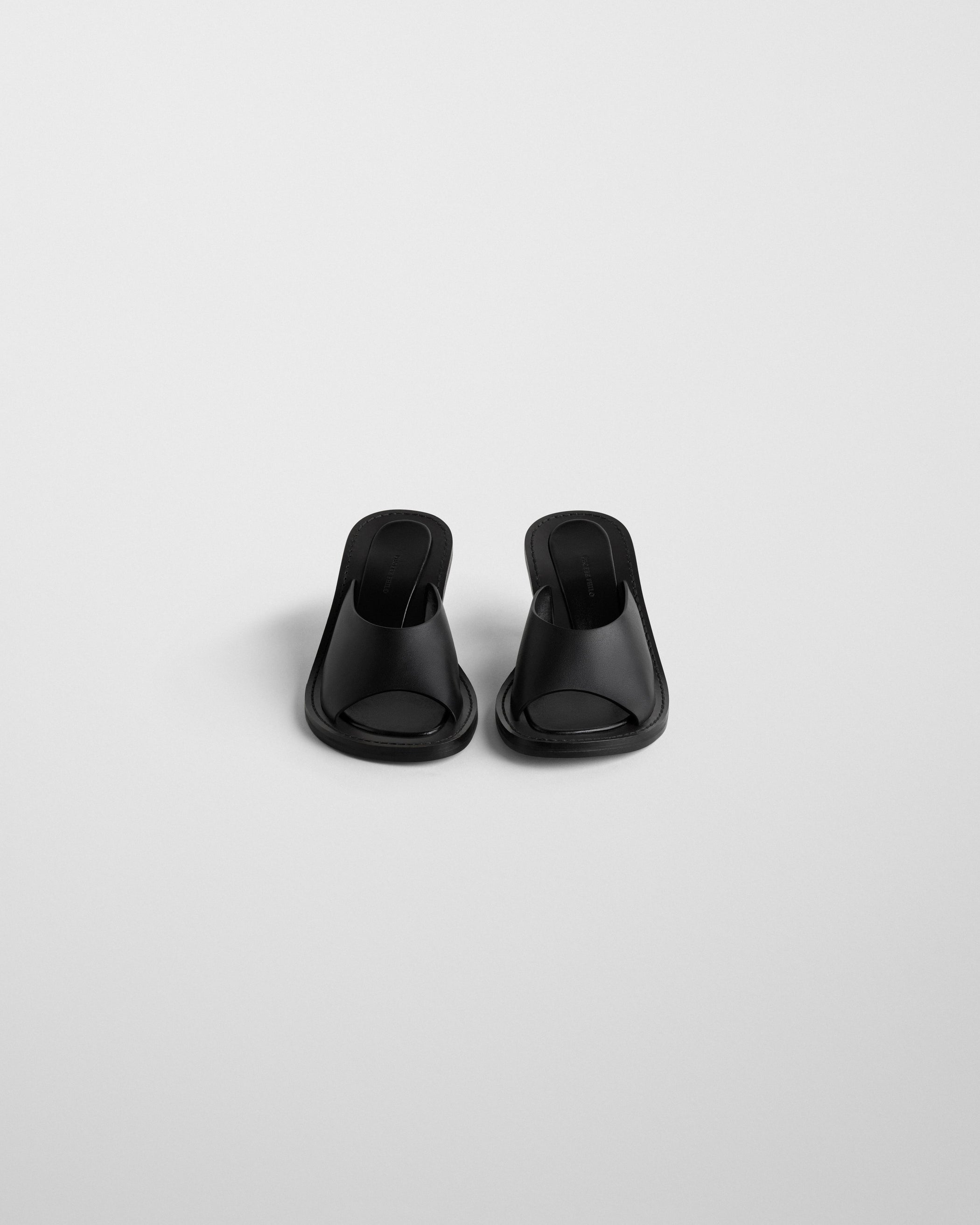Flat front image of STRAP MULE in black leather