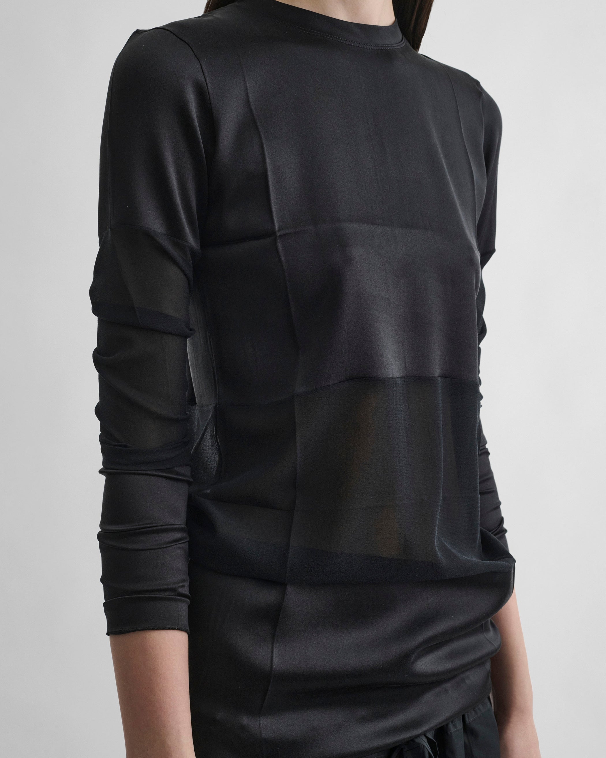 Detail view of PANEL TOP in black silk