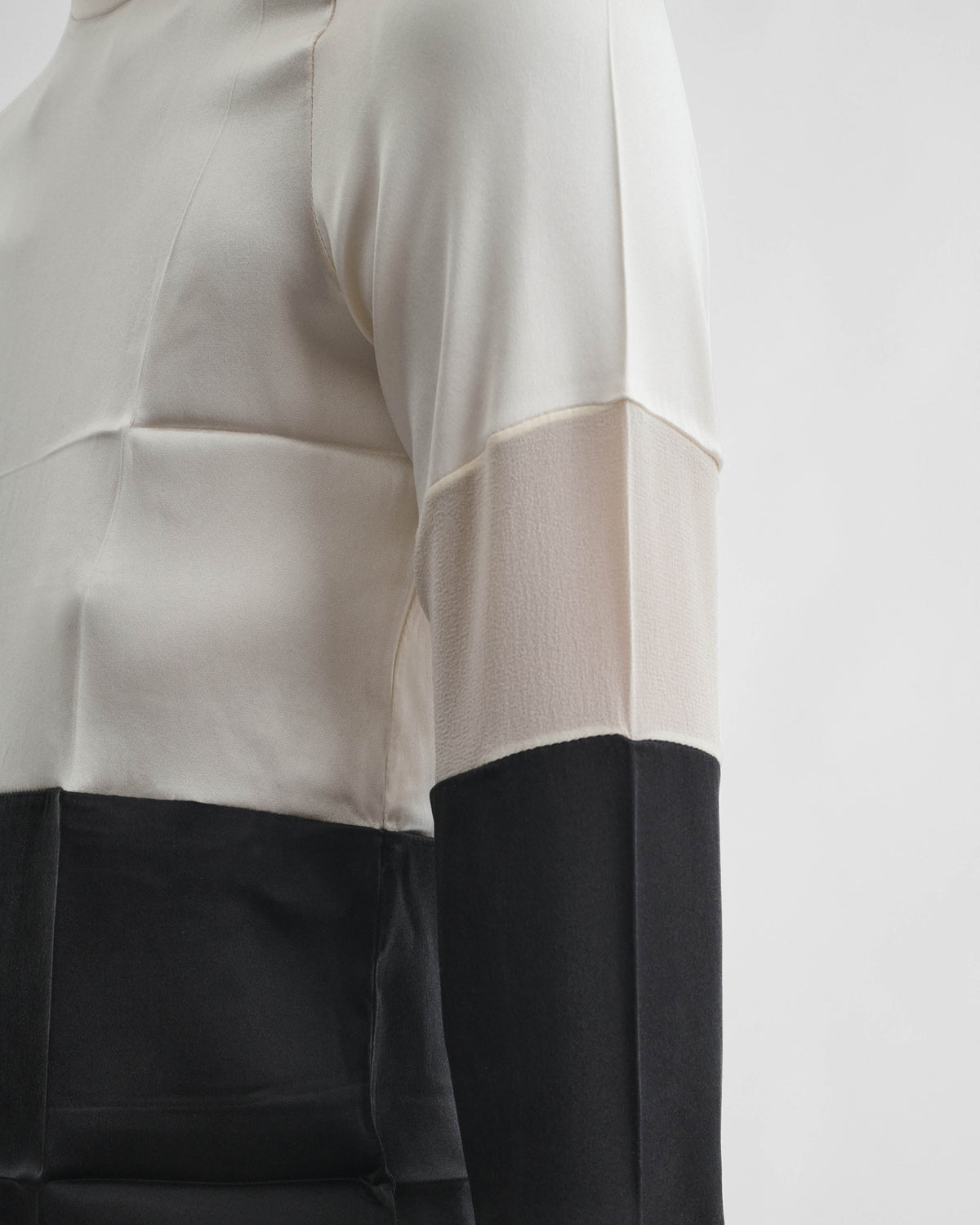 Detail view of model wearing PANEL TOP in black white silk