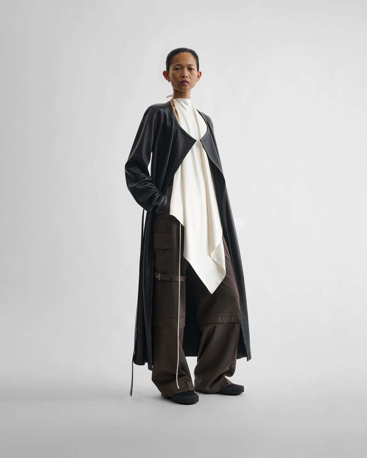 Angled front view of model wearing LIQUID SCARF TOP in cream silk