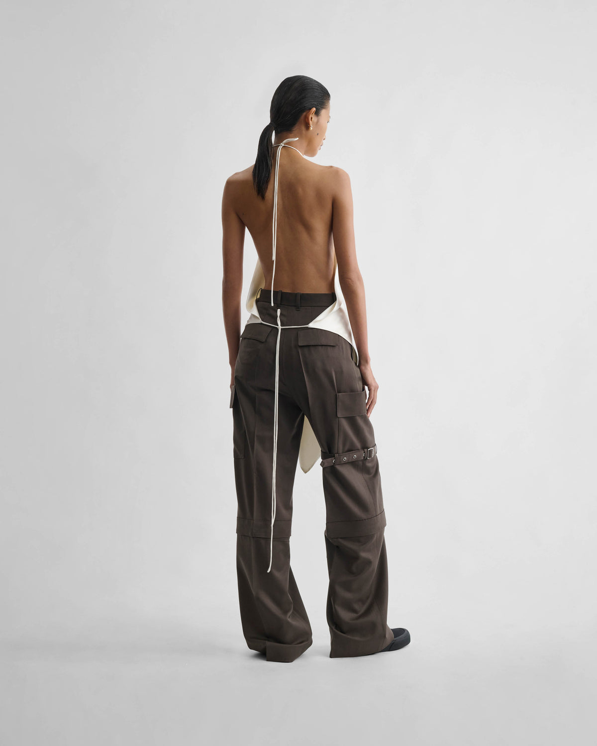 Back view of model wearing LIQUID SCARF TOP in cream silk
