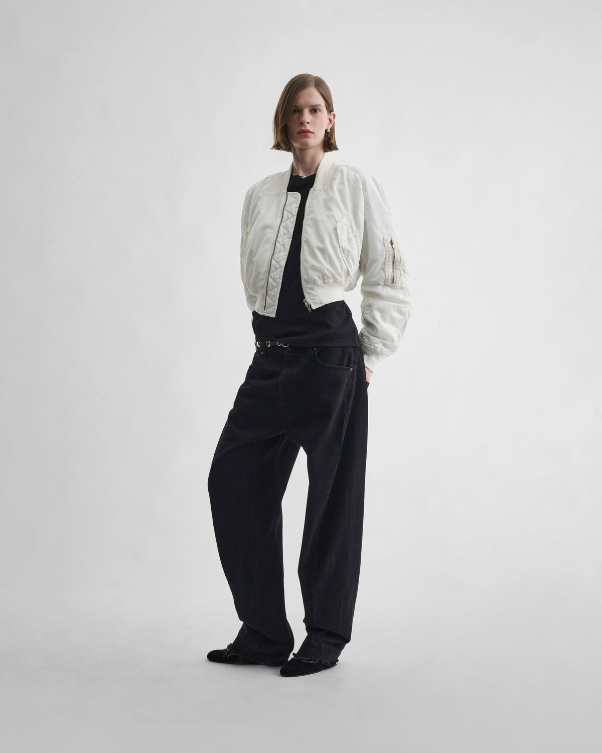 Front view of model wearing WASHED BOMBER in plaster white nylon