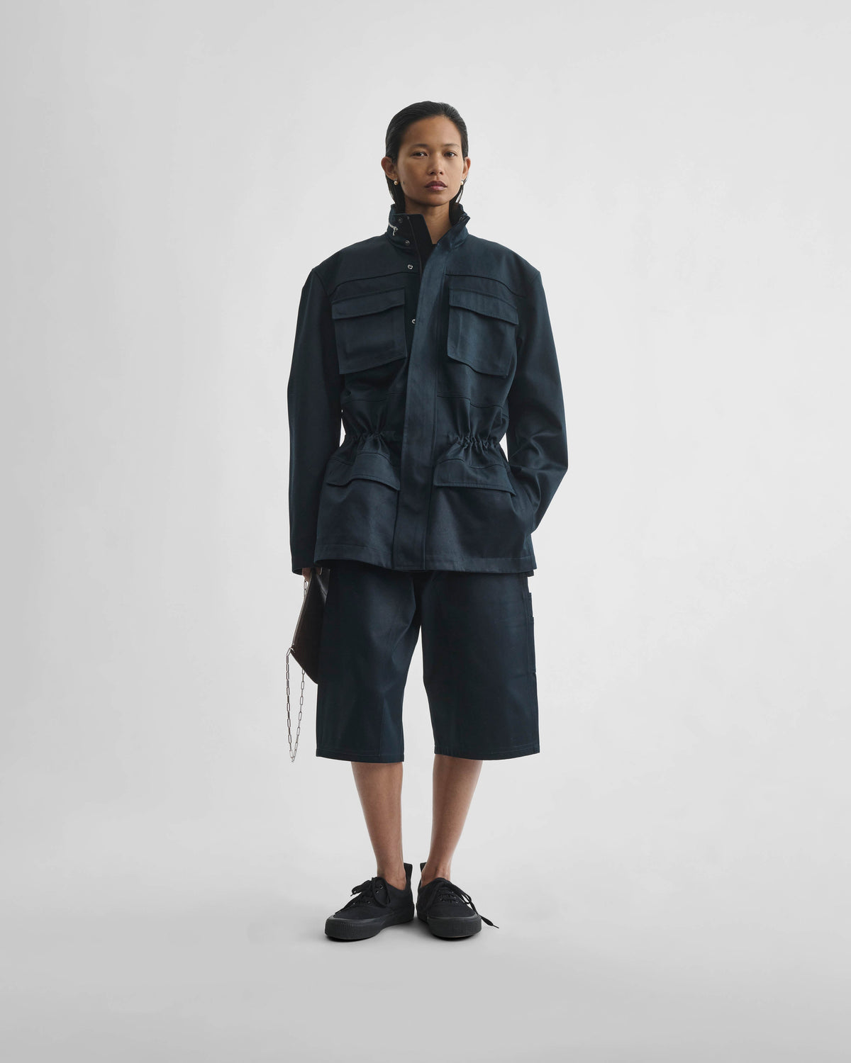 Front view of model wearing UTILITY JACKET in black ink cotton