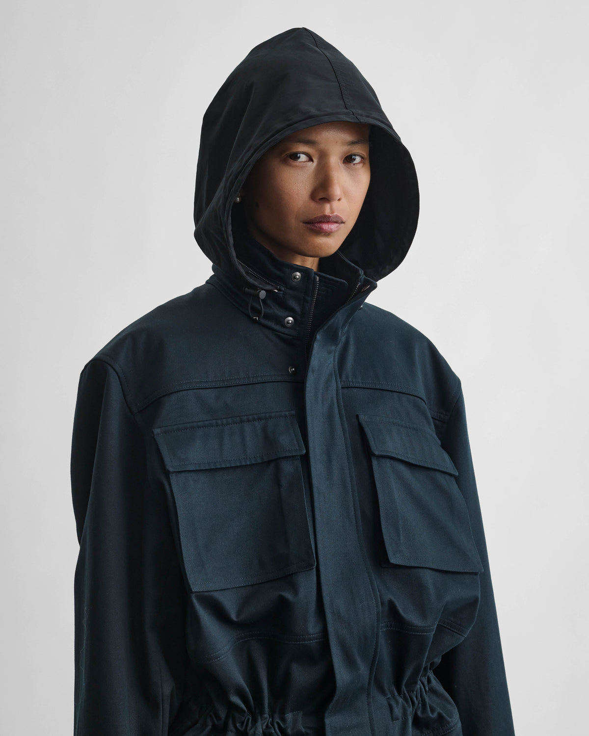 Front detail view of model wearing UTILITY JACKET in black ink cotton