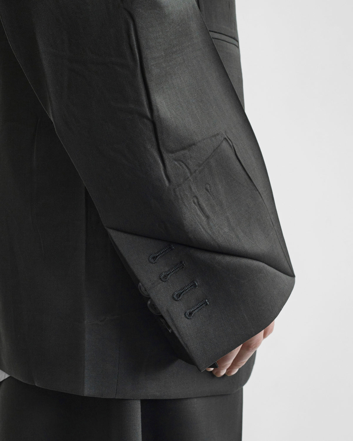 Detail view of model wearing NEAPOLITAN JACKET in green bronze wool
