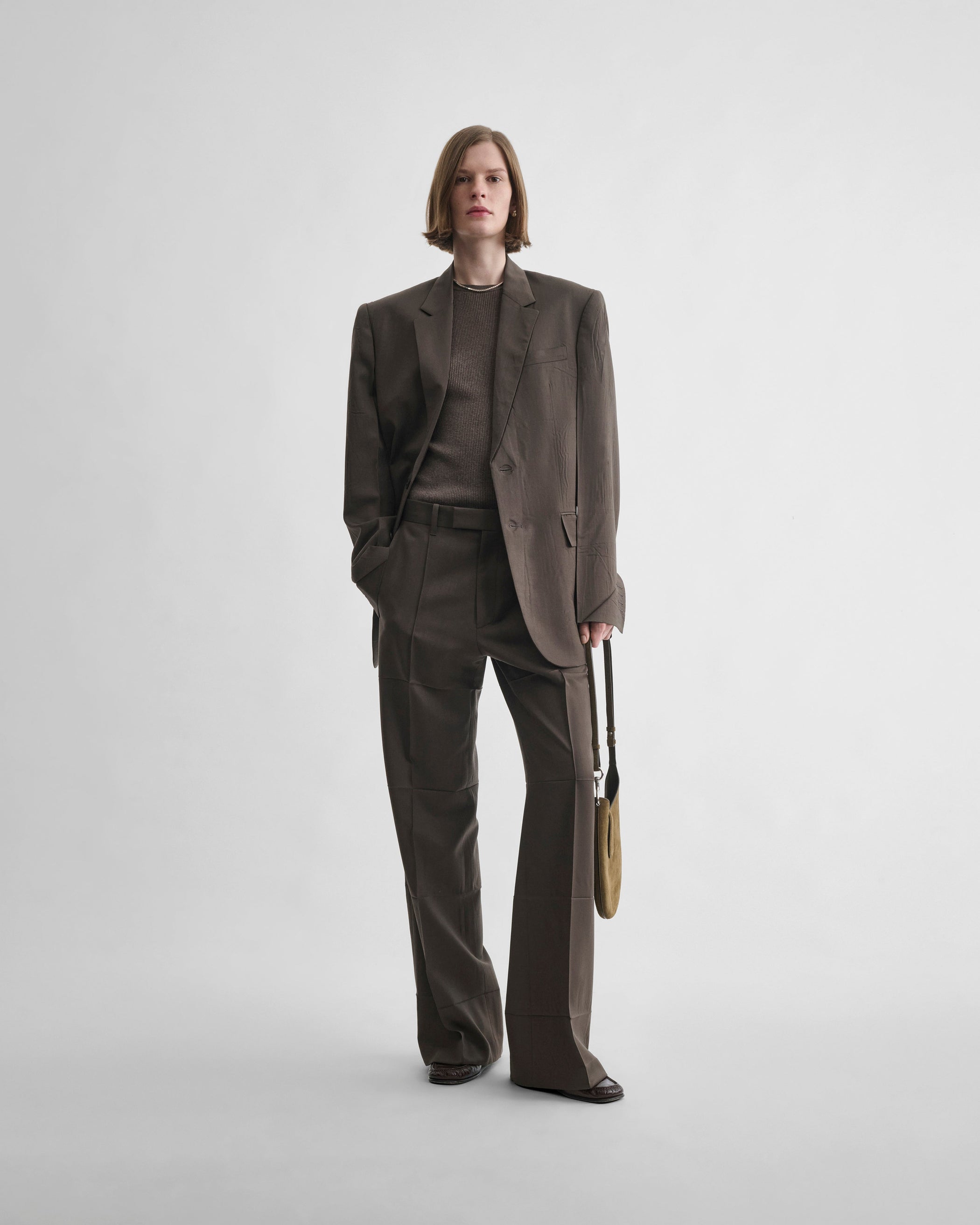 Front view of model wearing NEAPOLITAN JACKET in brown khaki wool