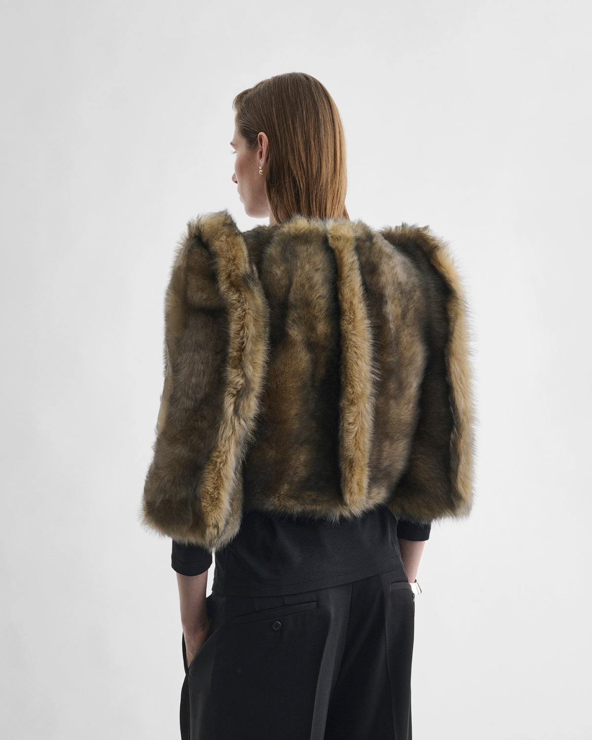 Back view of model wearing DANCER JACKET in blue apricot shearling