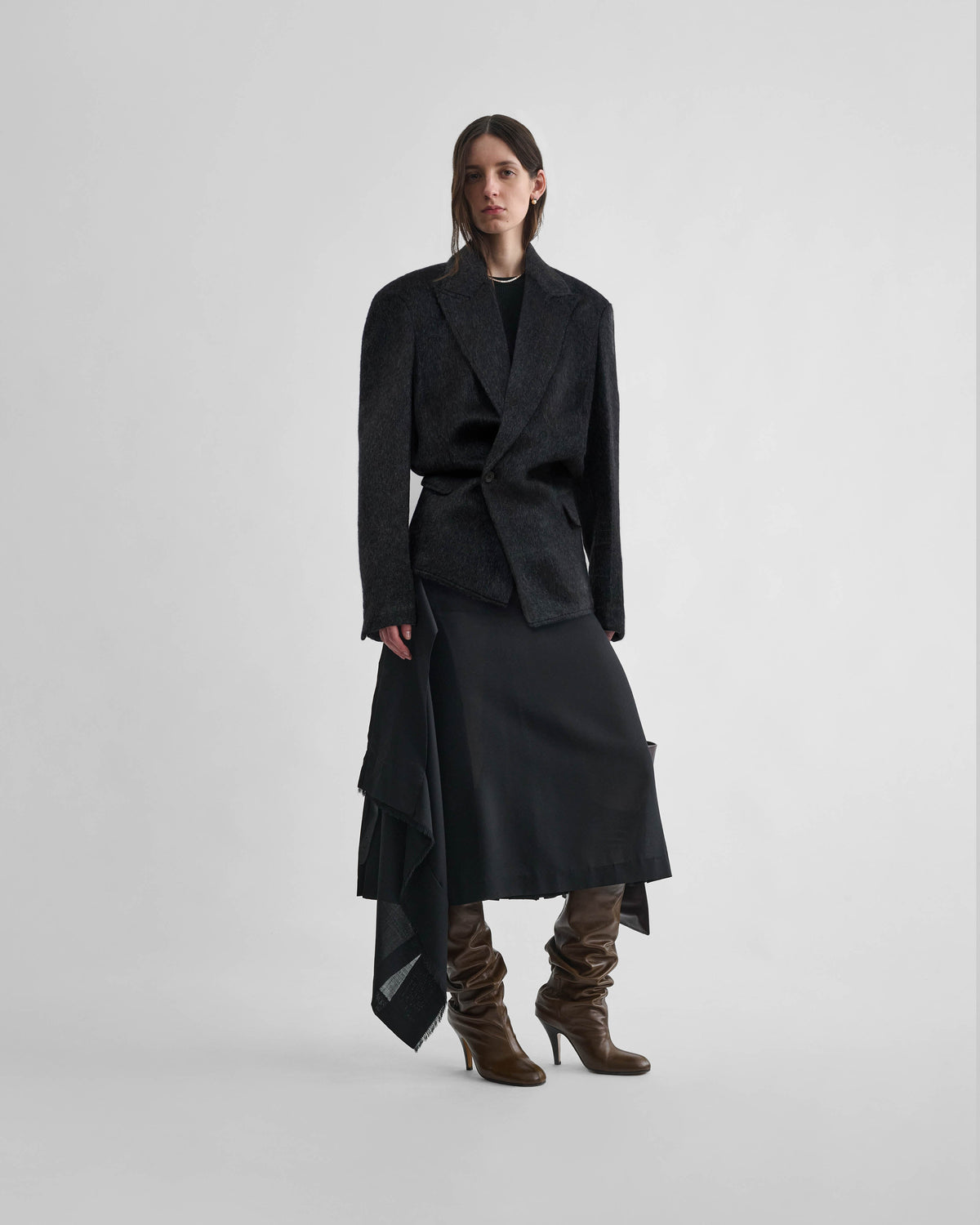 Front view of model wearing KINKED JACKET in anthracite wool