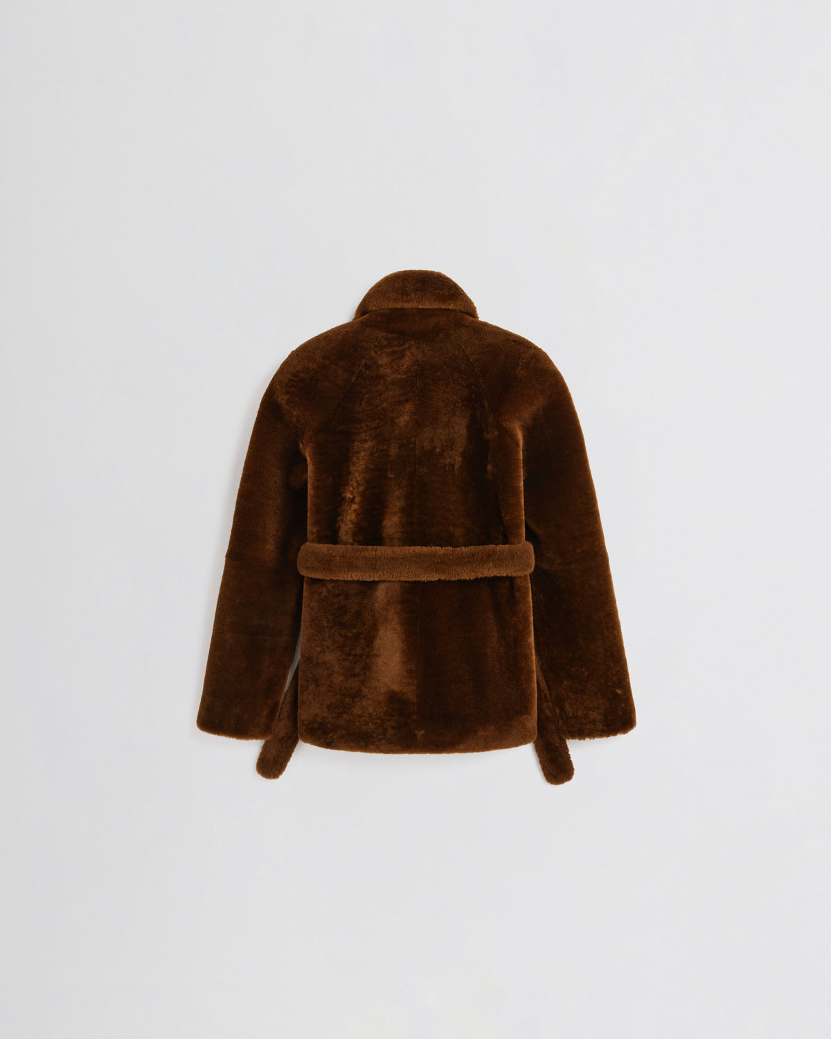 Flat back view of BELTED ROBE JACKET in burnt orange shearling